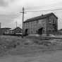 Black and white photograph of the Como Shops, 1892. Photograph by Robert Murray Frame III.