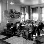 Black and white photograph of the interior of Cottage One at the State School, c.1900.