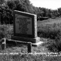 Black and white photograph of the monument marking where the Younger brothers were captured, c.1930.