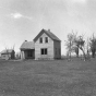 Black and white photograph of a farm abandoned after successive years of drought, possibly near Breckenridge in Wilkin County, 1939.