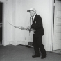 Black and white photograph of a man Playing the Kheng, Frogtown, 1994. Photograph by Wing Young Huie.