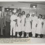 Twin Cities Arsenal cafeteria section head Oscar C. Howard and cafeteria employees, 1957. Industrial Relations Photographs, Twin Cities Army Ammunition Plant files, box 143.E.17.2F.,  Manuscripts Collection, Minnesota Historical Society.