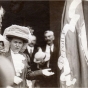 Black and white photograph of Mary Mehegan Hill speaking at a St. Paul event marking the fiftieth anniversary of the First Minnesota Volunteer Infantry Regiment’s departure for Civil War duty, 1911.. Hill presented a duplicate of an old Regimental flag to the group. 