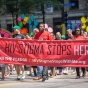 Minnesota AIDS Project volunteers marching in the 2013 Pride Parade