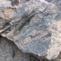 Color image of a gneiss boulder in Morton, 2016. Photograph by Paul Nelson.