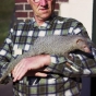 Photograph of Lloyd Hackl with Mr. Magoo the mongoose, 1963. 