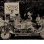 photograph of children on a parade float wearing Munsingwear long underwear.