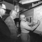 Paul Granlund looking at a map of St. Paul with Russell Fridley and Elmer L. Andersen