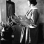 Black and white photograph of Elsa L. Jemne working at an easel, 1922.