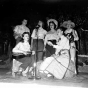 Black and white photograph of student nurses putting on a musical program for patients at Rochester State Hospital, 1958.