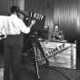 Black and white photograph of a KSTP-TV cameraman filming the This Side Up program, 1950.