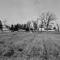 Black and white photograph of the Meeker County farm of the Charles Ness family, 1947.