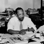 Cecil Newman at his desk