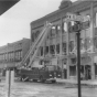 Black and white photograph of a fire truck outside the Opera House Block on South Main Street after the 1987 fire.
