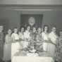 Black and white photograph of ten past BPWC presidents pose for a group photograph, 1961. From left to right: Gudvieg Norseth, Clara Berg, Belva Saugstad, Helen Espe, Clara Caouette, Frances Engebretson, Mae Rideout, Ruth Christenson, Ida Twedten, and Betty Ohman.