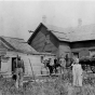 Polish immigrants in front of their farmhouse