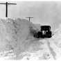 Car driving through a snowbank