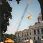 Color image of a construction crane lifting the quadriga into place over the Minnesota State Capitol's front entrance, June 21, 1995. Photographed by Linda A. Cameron