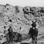 Black and white photograph of workers and a mule at a quarry in what now is Blue Mounds State Park, ca. 1880s.