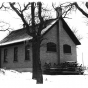 Photograph of the Ramsey District #28 School House after it was repurposed as the Ramsey Town Hall. Photographer unknown, ca. 1970s. Public domain.