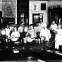 Black and white photograph of members of the Boys and Girls Club participating in a canning demonstration, 1920.