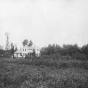 Black and white photograph of a Minnesota farm house, ca. 1890.