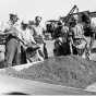 Black and white photograph of WPA crew mixing grasshopper bait for distribution to farmers, State Highway Maintenance Shops at Hopkins, 1937. 