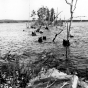 In the 1920s and 1930s, Ernest Oberholtzer documented flood damage associated with existing Rainy Lake dams in an attempt to prevent Edward Backus from constructing more dams, causing additional damage. This image documents damage related to a storage dam on Namakan Lake.