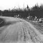 Black and white photograph of wrecked cars along Pike Lake Road near Duluth, 1918.