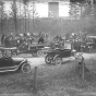 Black and white photograph of relief workers unloading coffins from Motor Corps vehicles after the fires of 1918.