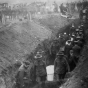 Black and white photograph of Minnesota Home Guardsmen burying dead of the Fires of 1918.