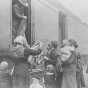 Black and white photograph of the National Guard giving out clothing to refugees, 1918. 