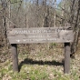 Sign within Savanna Portage State Park, 2018. Photograph by Jon Lurie; used with the permission of Jon Lurie.