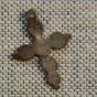 Color image of a silver cross pendant found at the Réaume site, 2012.