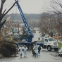 Photograph of volunteers clearing debris from a street in St. Peter. 