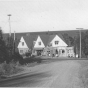 Black and white photograph of Stickney Inn and Store, facing south, from Cramer Road, with gas station at right, ca. 1940. 