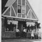 Black and white photograph of the exterior of Stickney’s grocery store, ca. 1930s.