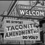 A sign outside a business promoting a “yes” vote on the taconite amendment, 1964.