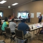 Color image of MCLA staff visit Marshall, Minnesota, for a listening session with residents, 2017.