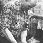 Volunteers Answer "Bird" Call - Newspaper photograph of a man washing off a duck