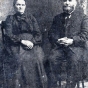 Black and white photograph of Elder Heinrich Voth (right) and his wife, Sara Voth (left), ca. 1910.