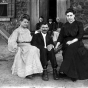 William Spangenberg seated with friends in a hammock