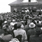 Black and white photograph of a crowd of more than a thousand people gathered on March 7, 1963, in front of the Albion French Lake Creamery.