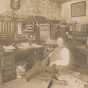 Black and white photograph of Waconia Patriot editor and publisher Charles Reil in his office, 1917.