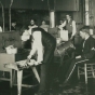 Black and white photograph of a butter-making class, University of Minnesota School of Agriculture, 1889.