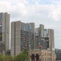 Color image of the he skyline of the Cedar-Riverside neighborhood of Minneapolis viewed from the north. At center are the Riverside Plaza complex of apartment buildings and Mixed Blood Theatre. Photograph by Ibrahim Hirsi, May 3, 2017.