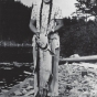 Black and white photograph of Dorothy Molter holding a lake trout, ca. 1940s.