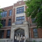 Color image of the front entrance of Cleveland Junior High School (now Farnsworth Aerospace Pre-K-8 School) in St. Paul designed by Clarence Wigington and built in 1924. Photographed by Paul Nelson on August 15, 2014.