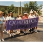 Quatrefoil Library volunteers march during Pride in Minneapolis, 1988