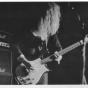 Black and white photograph of Kat Bjelland performing with Babes in Toyland in Paris, 1991. 